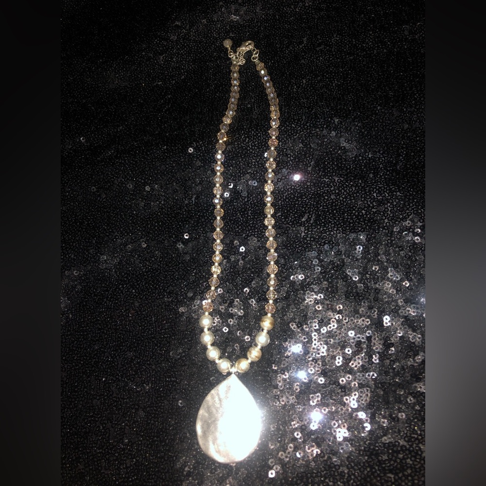 Silver beaded necklace.  With silver pendant.